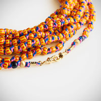 Marie Lichtenberg Staging Link Mauli beads ghana orange & red 4m